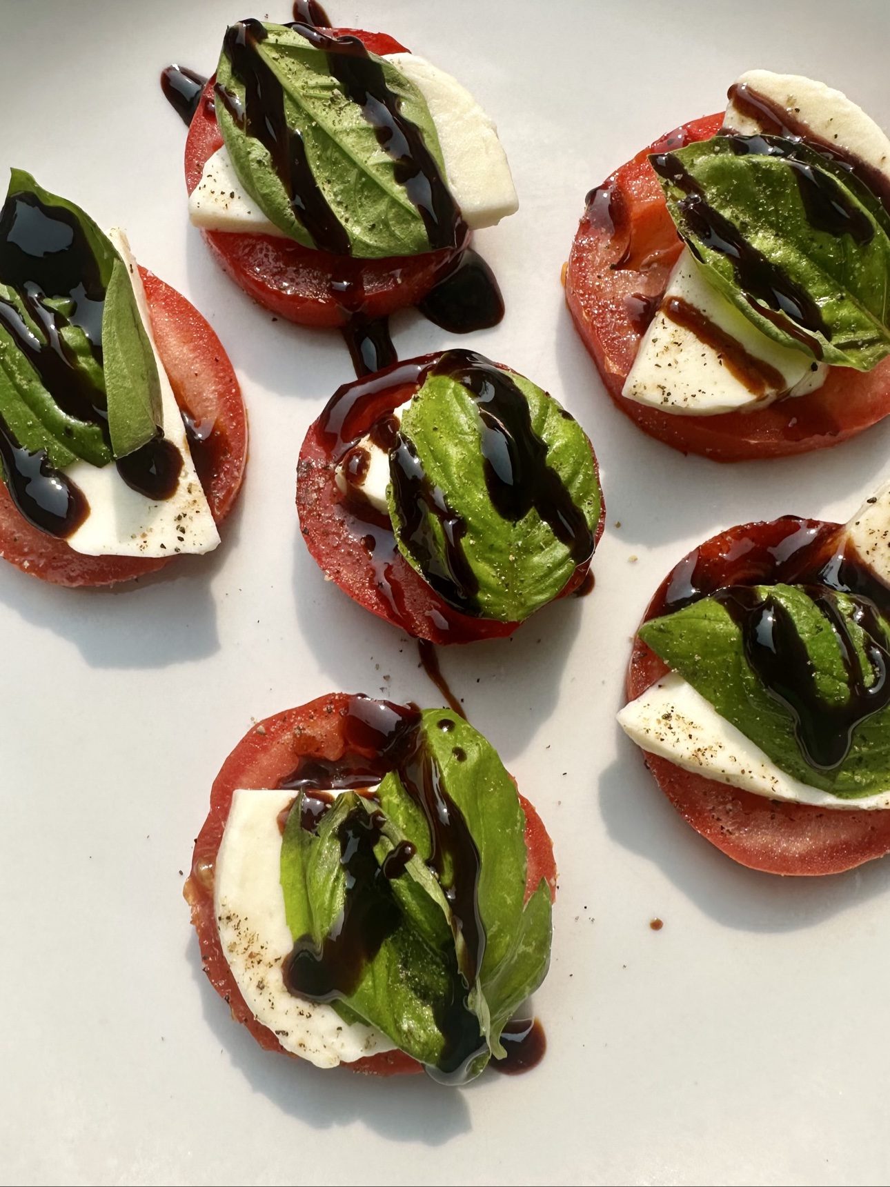 Caprese bites with tomato, mozzarella, basil and balsamic glaze